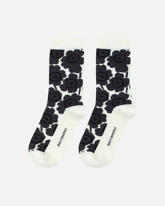 Pair of Marimekko socks with black floral pattern on a white background